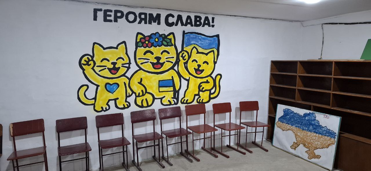 Creating murals in the College's shelter